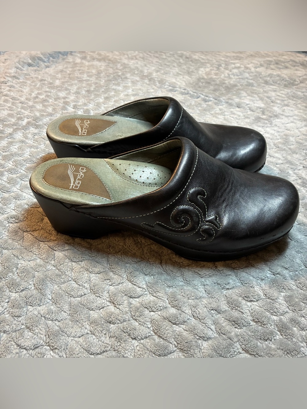 Dansko Black Leather Slip-On Clog with Subtle Embroidered Detail